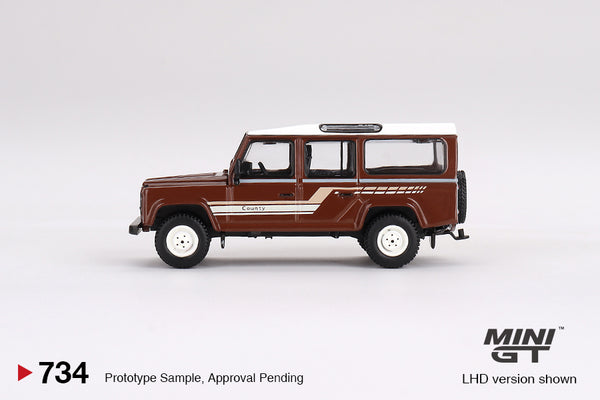 MINI GT 0734 - Land Rover Defender 110 1985 County Station Wagon Russet Brown